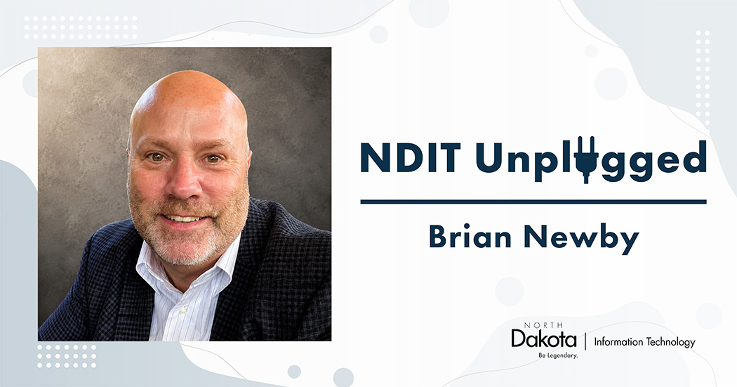 Brian Newby’s professional headshot placed in a light-colored NDIT Unplugged graphic that shows his name and NDIT’s logo.