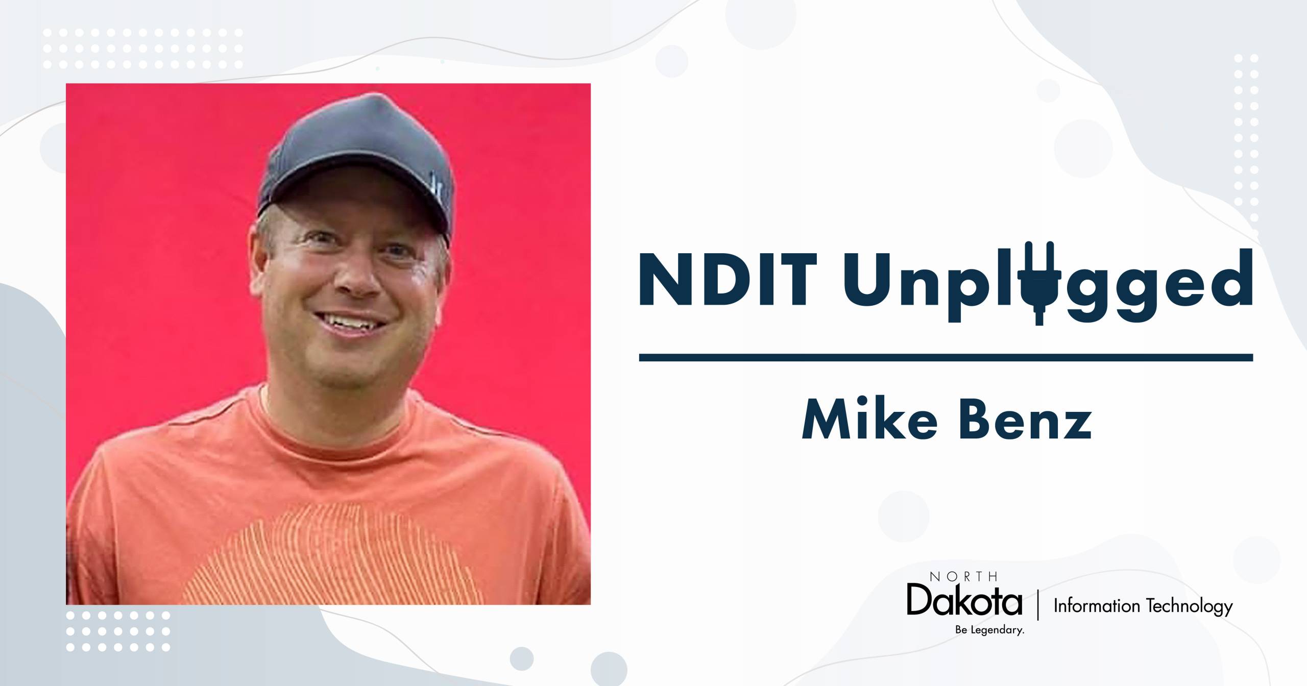 Mike Benz headshot placed in a light-colored NDIT Unplugged graphic that shows his name and NDIT’s logo.