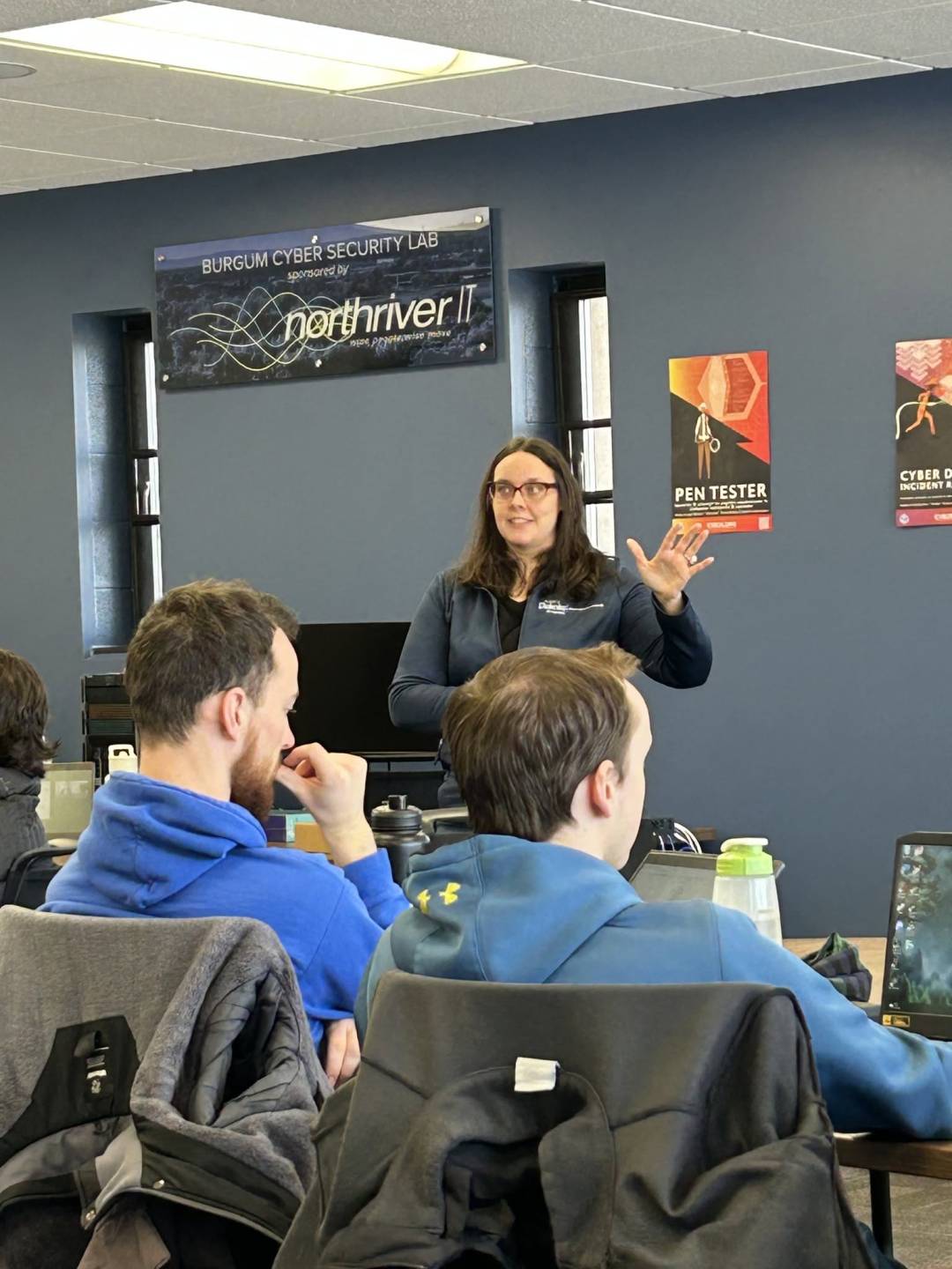 Colleen T. eagerly presents on resume building and job interview tips in front of a University of Mary class in Bismarck, ND.