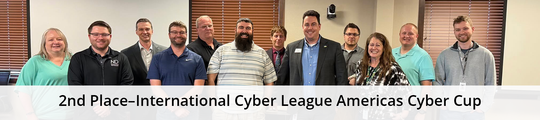A group of NDIT team members with an overlay that says, “Second place–International Cyber League Americas Cyber Cup.”
