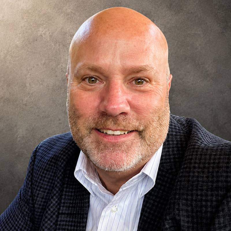 Brian Newby’s professional headshot.