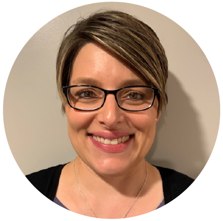 Aimee Bader, Compliance & Records Manager has short hair, wearing dark-framed glasses and a black shirt.