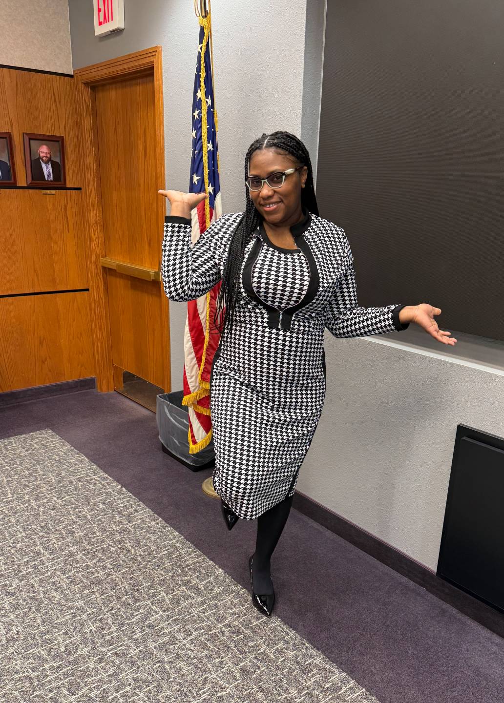 Ingrid Clarke smiles while swinging out her arms and standing on one foot before presenting to one of North Dakota’s agencies
