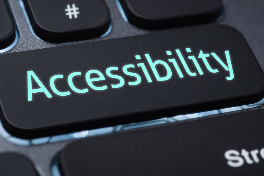 The word "Accessibility" in light green text on a black keyboard button.